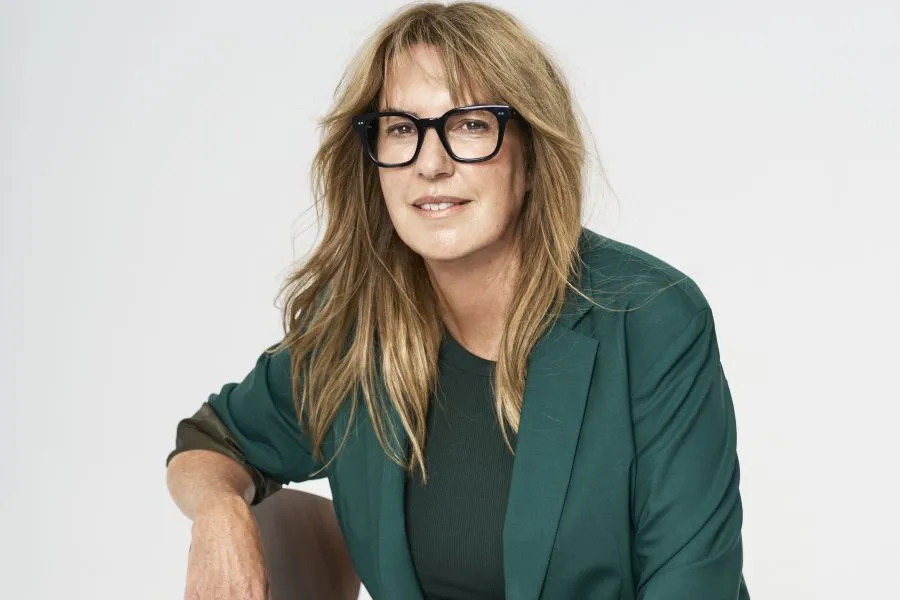 Dr. Iona Weir in a green suit.